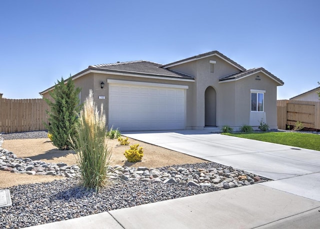 703 Sycamore Dr, Fallon, NV 89406 - ranch-style house with a garage, driveway, stucco siding, and a tiled roof