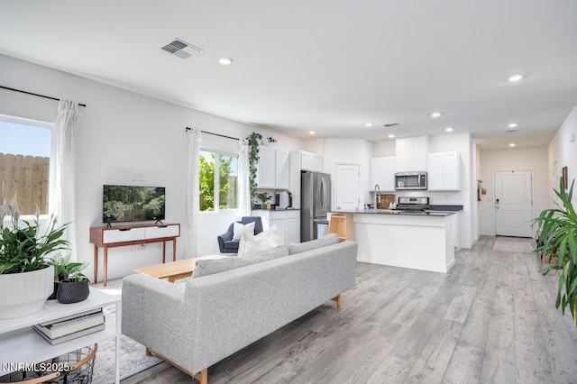 703 Sycamore Dr, Fallon, NV 89406 - living room featuring light wood-style floors and recessed lighting