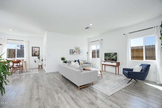 703 Sycamore Dr, Fallon, NV 89406 - living area with light wood-style floors, healthy amount of natural light, and recessed lighting
