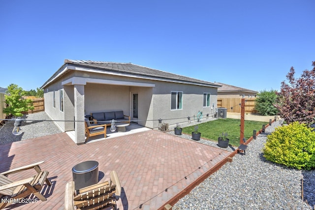 703 Sycamore Dr, Fallon, NV 89406 - rear view of house featuring outdoor lounge area, stucco siding, central AC, a patio, and a wooden deck