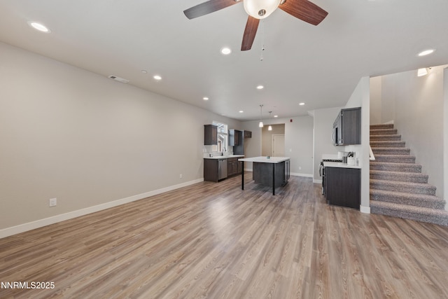 1170 Montevideo Cir, Minden, NV 89423 - living area featuring recessed lighting, light wood finished floors, baseboards, stairs, and a ceiling fan