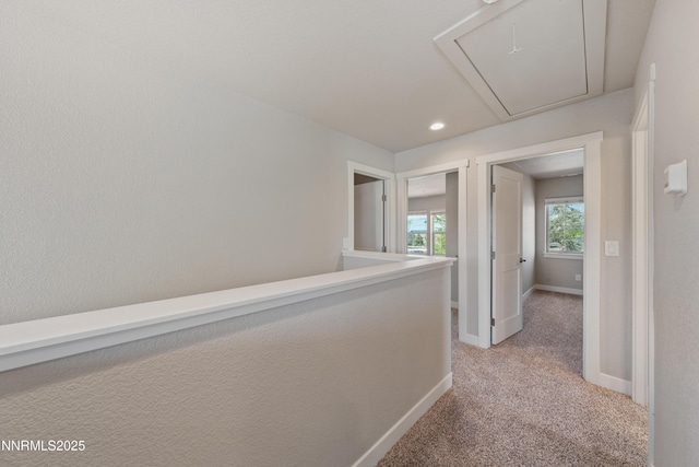 1170 Montevideo Cir, Minden, NV 89423 - hall featuring attic access, light colored carpet, baseboards, and recessed lighting