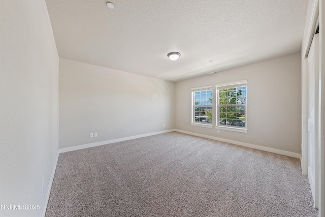 1170 Montevideo Cir, Minden, NV 89423 - empty room featuring carpet floors, baseboards, and a textured ceiling