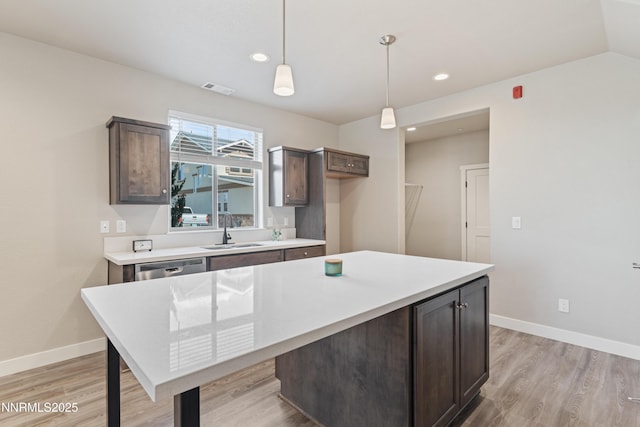 1170 Montevideo Cir, Minden, NV 89423 - kitchen with a sink, dark brown cabinetry, light wood-style flooring, and recessed lighting