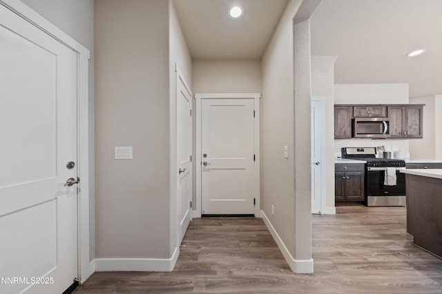 1170 Montevideo Cir, Minden, NV 89423 - hallway featuring light wood-style floors, baseboards, and recessed lighting