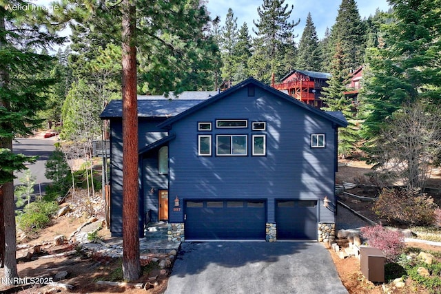 997 Dorcey Dr, Incline Village, NV 89451 - rustic home with an attached garage, driveway, and stone siding