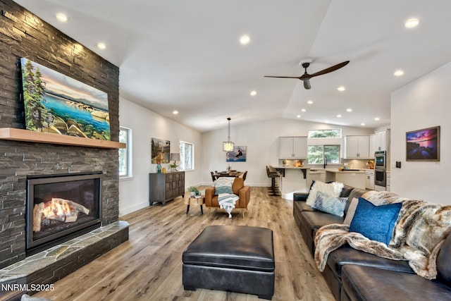 997 Dorcey Dr, Incline Village, NV 89451 - living area with light wood-type flooring, vaulted ceiling, ceiling fan, baseboards, and recessed lighting