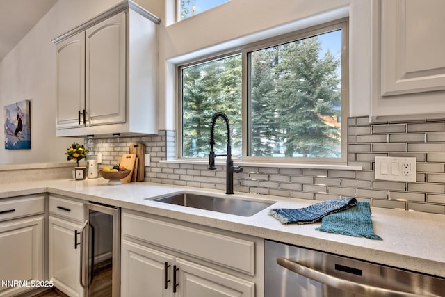 997 Dorcey Dr, Incline Village, NV 89451 - kitchen with beverage cooler, a sink, stainless steel dishwasher, and backsplash