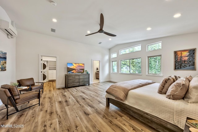 997 Dorcey Dr, Incline Village, NV 89451 - bedroom featuring light wood-type flooring, lofted ceiling, recessed lighting, an AC wall unit, and a walk in closet
