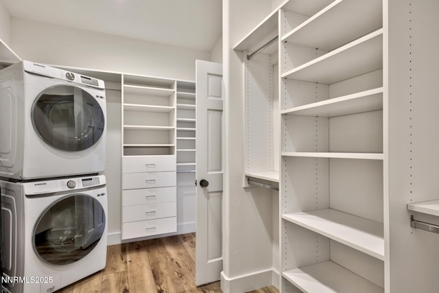 997 Dorcey Dr, Incline Village, NV 89451 - washroom featuring stacked washer / drying machine, light wood finished floors, and baseboards