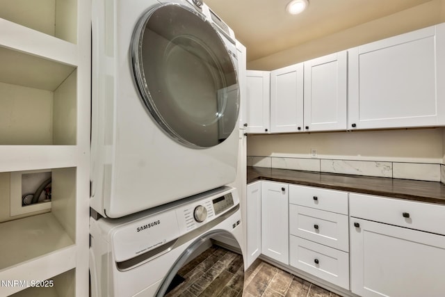 997 Dorcey Dr, Incline Village, NV 89451 - laundry area with cabinet space, stacked washer and clothes dryer, wood finished floors, and recessed lighting
