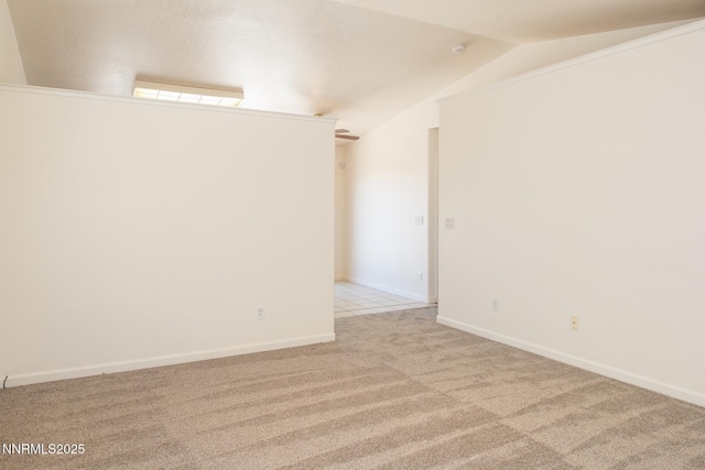 7344 Rubens Ct, Sun Valley, NV 89433 - empty room with light colored carpet, vaulted ceiling, and baseboards