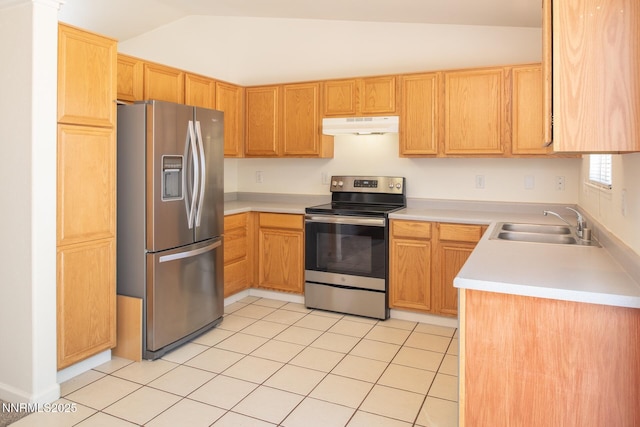 7344 Rubens Ct, Sun Valley, NV 89433 - kitchen featuring stainless steel appliances, under cabinet range hood, vaulted ceiling, a sink, and light countertops