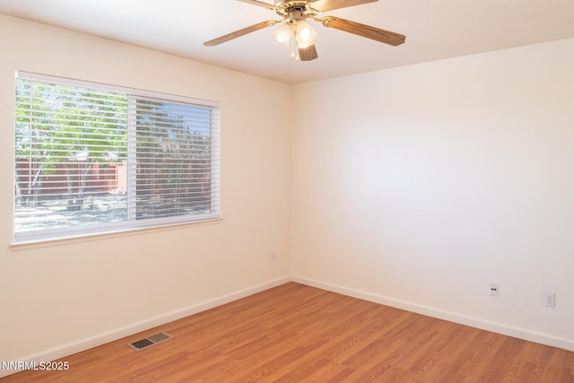 7344 Rubens Ct, Sun Valley, NV 89433 - unfurnished room with light wood finished floors, baseboards, and a ceiling fan