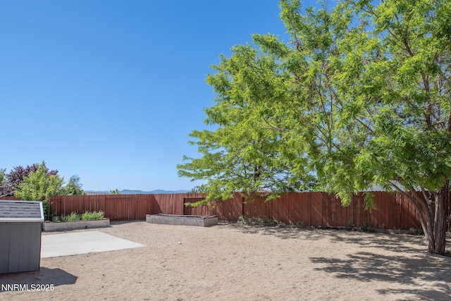 7344 Rubens Ct, Sun Valley, NV 89433 - fenced backyard with a patio