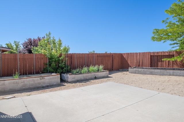 7344 Rubens Ct, Sun Valley, NV 89433 - fenced backyard with a patio area