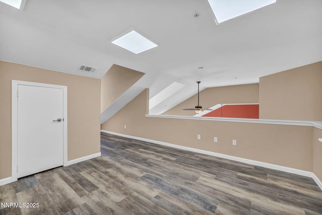 17000 Wedge Pkwy Unit 2624, Reno, NV 89511 - unfurnished living room featuring wood finished floors, baseboards, a skylight, lofted ceiling, and a ceiling fan