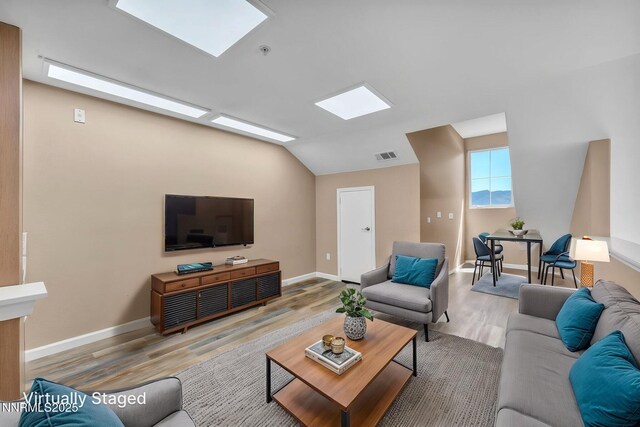 17000 Wedge Pkwy Unit 2624, Reno, NV 89511 - living area with wood finished floors, vaulted ceiling, and baseboards