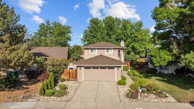 2731 Wabash Cir, Sparks, NV 89434 - traditional-style house with concrete driveway, a chimney, a garage, and a shingled roof