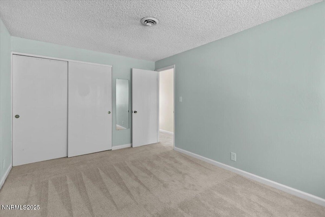 2731 Wabash Cir, Sparks, NV 89434 - unfurnished bedroom with a textured ceiling, carpet, a closet, and baseboards