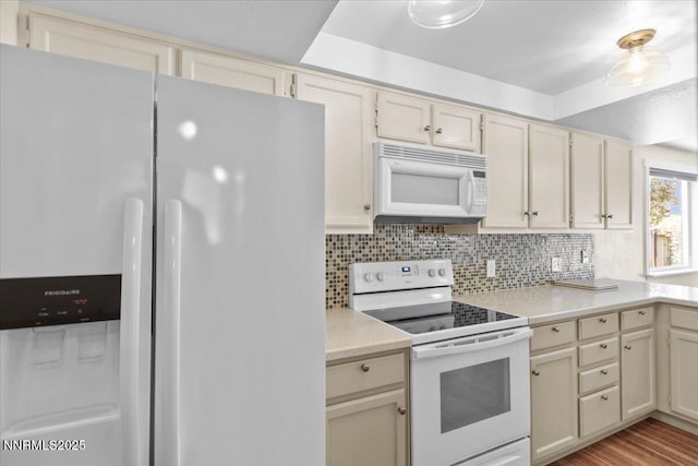 2731 Wabash Cir, Sparks, NV 89434 - kitchen with white appliances, light countertops, tasteful backsplash, cream cabinets, and light wood-style flooring