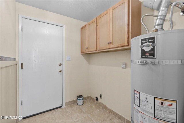 2731 Wabash Cir, Sparks, NV 89434 - laundry room with water heater, cabinet space, and light tile patterned flooring