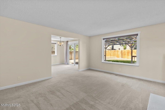 2731 Wabash Cir, Sparks, NV 89434 - carpeted spare room with a chandelier, baseboards, and a textured ceiling