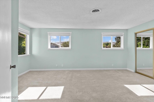 2731 Wabash Cir, Sparks, NV 89434 - carpeted spare room with a textured ceiling, healthy amount of natural light, and baseboards
