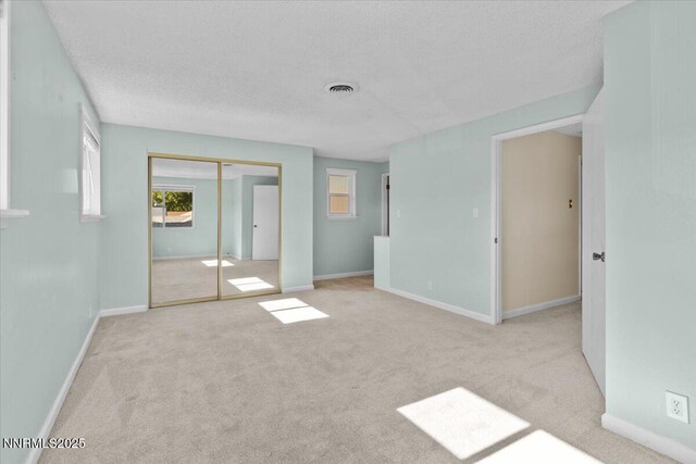 2731 Wabash Cir, Sparks, NV 89434 - unfurnished bedroom featuring carpet, a textured ceiling, a closet, and baseboards