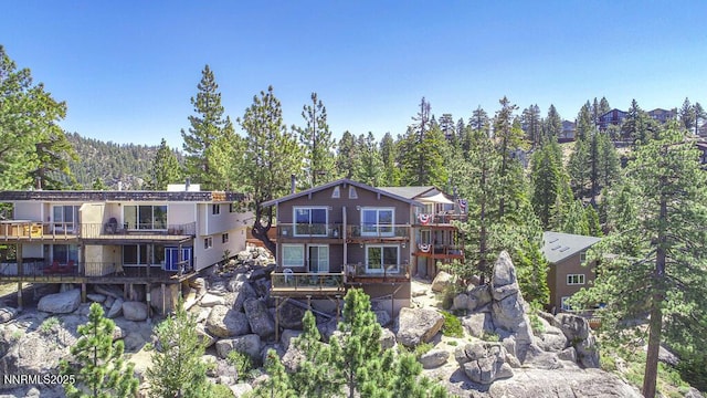 710 Tina Ct # B-2, Stateline, NV 89449 - back of house with a balcony and a forest view