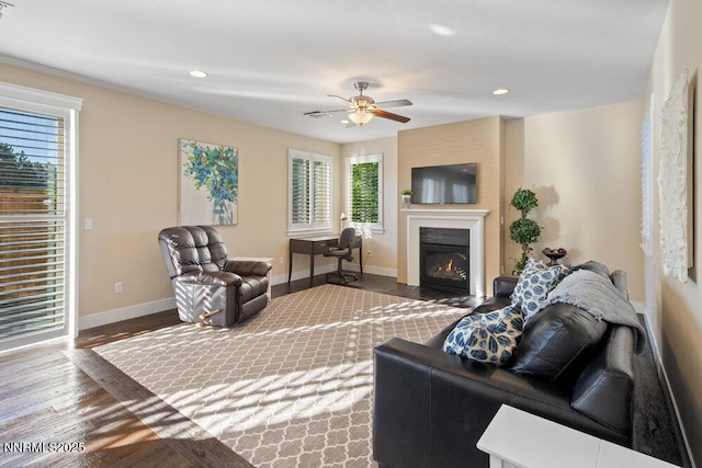 1385 Balfour Dr, Reno, NV 89509 - living area with baseboards, wood finished floors, a glass covered fireplace, a ceiling fan, and recessed lighting