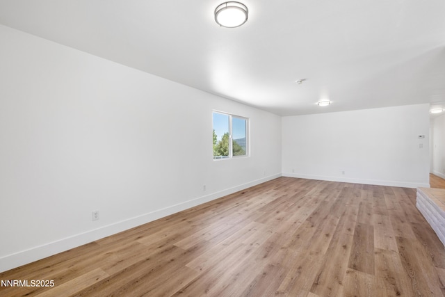 10835 Silver Knolls Blvd, Reno, NV 89508 - unfurnished living room with light wood-type flooring and baseboards