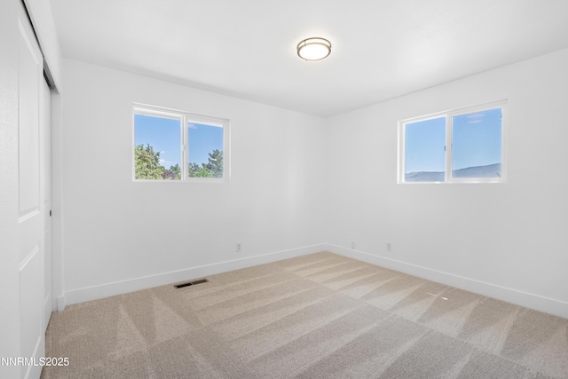 10835 Silver Knolls Blvd, Reno, NV 89508 - unfurnished bedroom with light carpet, a closet, baseboards, and multiple windows