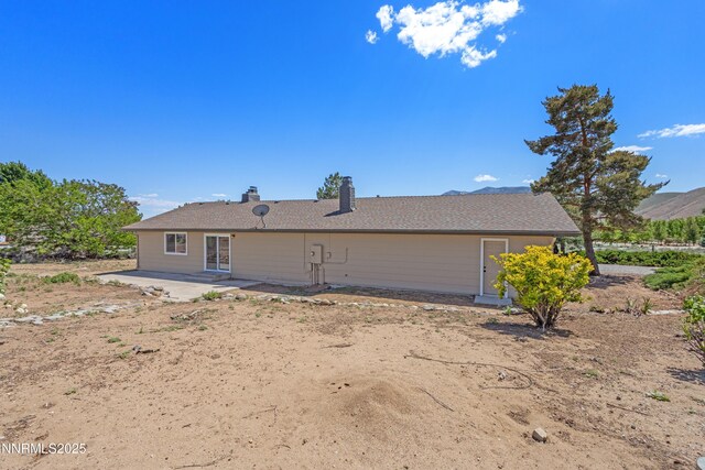 10835 Silver Knolls Blvd, Reno, NV 89508 - back of house with a patio and a chimney