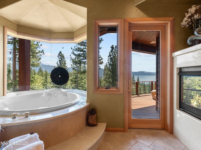 563 Knotty Pine Dr, Incline Village, NV 89451 - full bath with plenty of natural light, a garden tub, and a mountain view