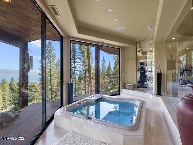 563 Knotty Pine Dr, Incline Village, NV 89451 - bathroom featuring tile patterned floors, a garden tub, plenty of natural light, and recessed lighting