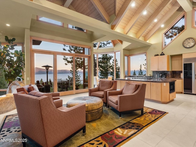 563 Knotty Pine Dr, Incline Village, NV 89451 - living area with high vaulted ceiling, wood ceiling with exposed beams, light tile patterned floors, and a water view