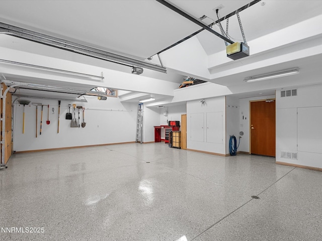 563 Knotty Pine Dr, Incline Village, NV 89451 - garage with baseboards and a garage door opener