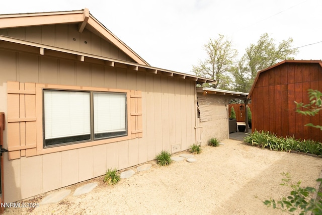 360 Ruby St, Fernley, NV 89408 - view of side of home with a storage unit