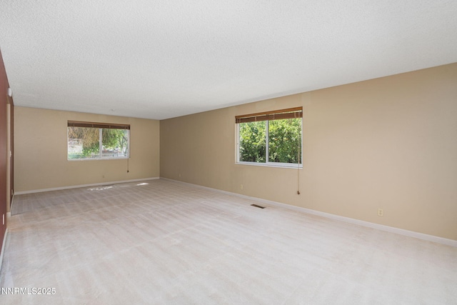 3164 Clan Alpine Dr, Sparks, NV 89434 - unfurnished room featuring light colored carpet, baseboards, and a textured ceiling