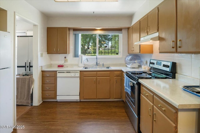 110 Smithridge Park, Reno, NV 89502 - kitchen with white appliances, a sink, under cabinet range hood, light countertops, and dark wood-type flooring