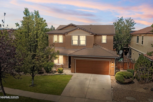7121 Jermann Dr, Sparks, NV 89436 - traditional home featuring a tile roof, concrete driveway, and stucco siding