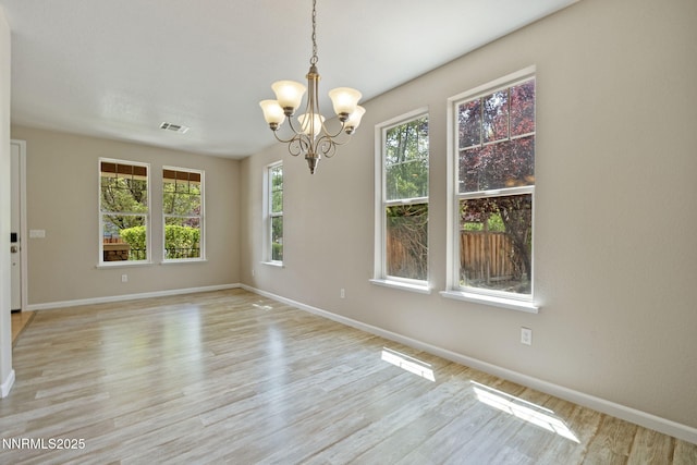 7121 Jermann Dr, Sparks, NV 89436 - spare room with a chandelier and light wood-style flooring