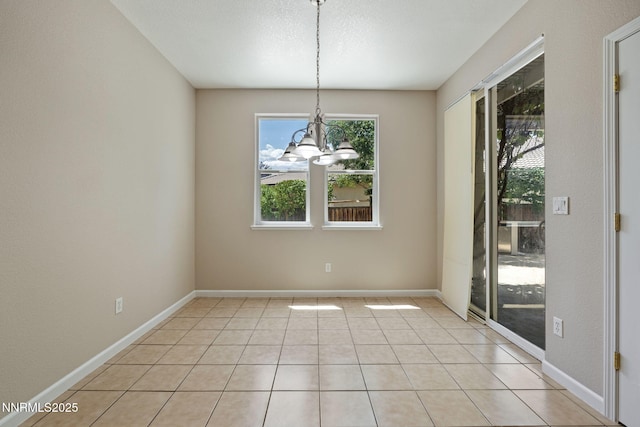 7121 Jermann Dr, Sparks, NV 89436 - unfurnished dining area with a chandelier and light tile patterned floors