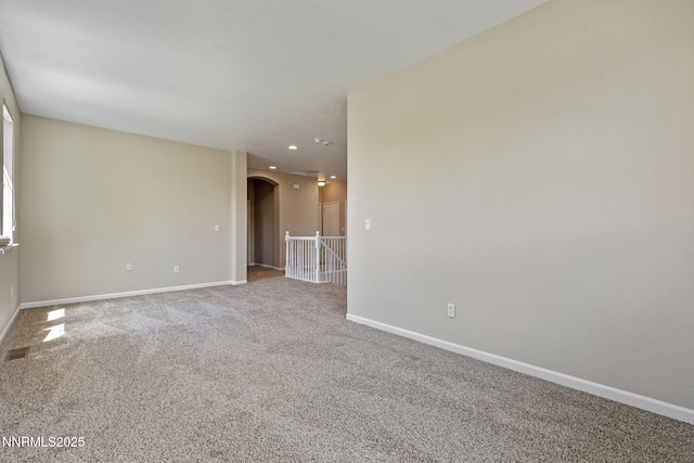 7121 Jermann Dr, Sparks, NV 89436 - carpeted spare room with arched walkways and recessed lighting