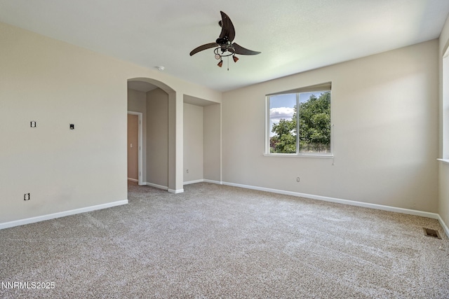 7121 Jermann Dr, Sparks, NV 89436 - spare room with a ceiling fan, carpet floors, and arched walkways