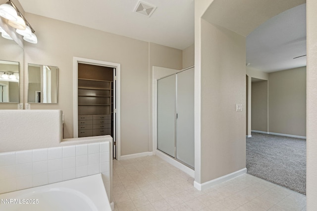7121 Jermann Dr, Sparks, NV 89436 - bathroom with a shower stall, a garden tub, and a walk in closet