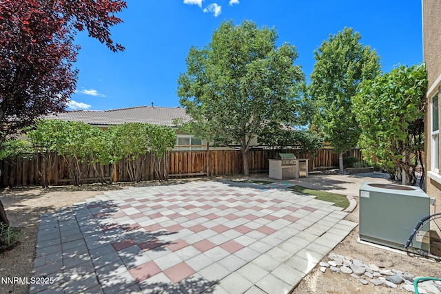 7121 Jermann Dr, Sparks, NV 89436 - fenced backyard featuring a patio area