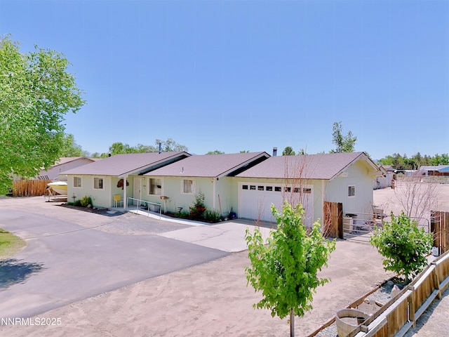 1331 Stephanie Way, Minden, NV 89423 - ranch-style home with an attached garage and driveway