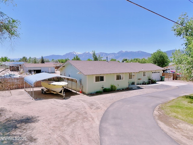 1331 Stephanie Way, Minden, NV 89423 - single story home with a carport, driveway, and a mountain view